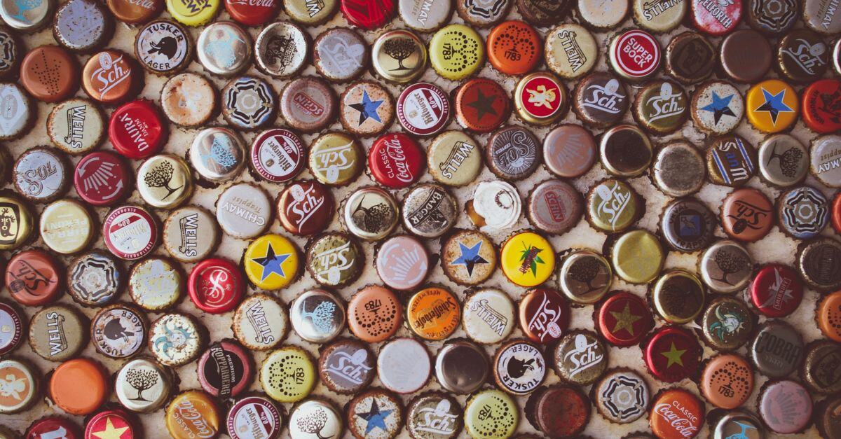 Assortment of bottle caps sitting on a table